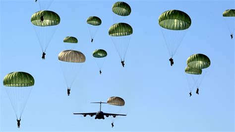 female paratroopers jumping out of planes