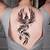 feminine black phoenix tattoo