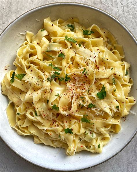 Fettuccine noodles are tossed with artichoke hearts, fresh basil and