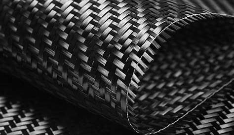 Black carbon fiber composite material background PRISMA