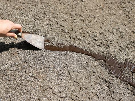 filling cracks in blacktop driveway