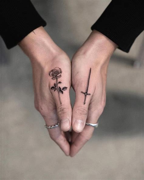 finger tattoos sword