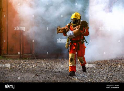 firefighter walking out of fire