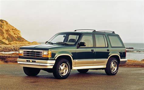 A classic first-generation Ford Explorer from the early 1990s, showcasing its rugged SUV design.