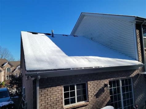 flat roof leaking after snow