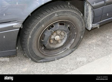 Flat tire on side of road