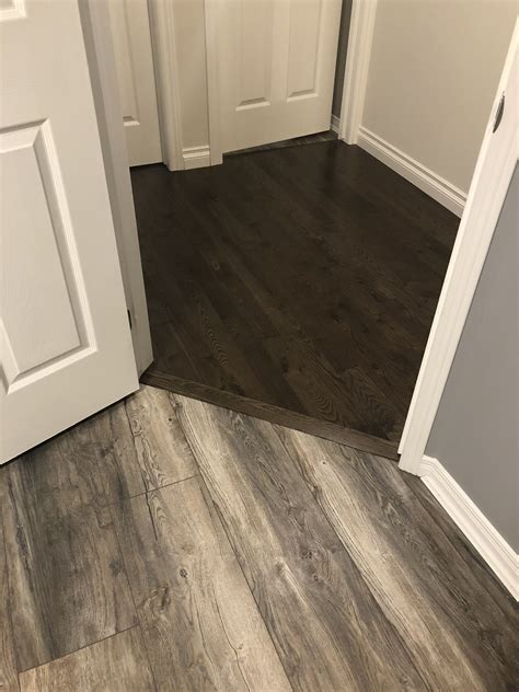 Flooring how do i transition from a wood floor to tile that has a 11