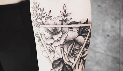 Black and red roses inside a triangle on the forearm.