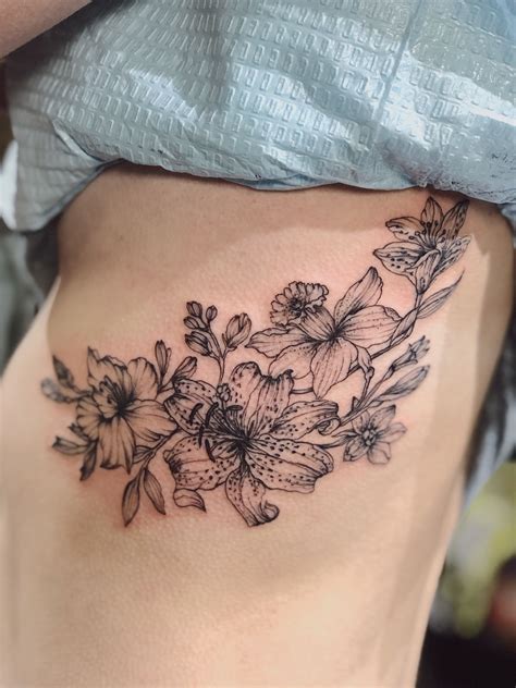 Powerful Flower Rib Cage Tattoo Designs References