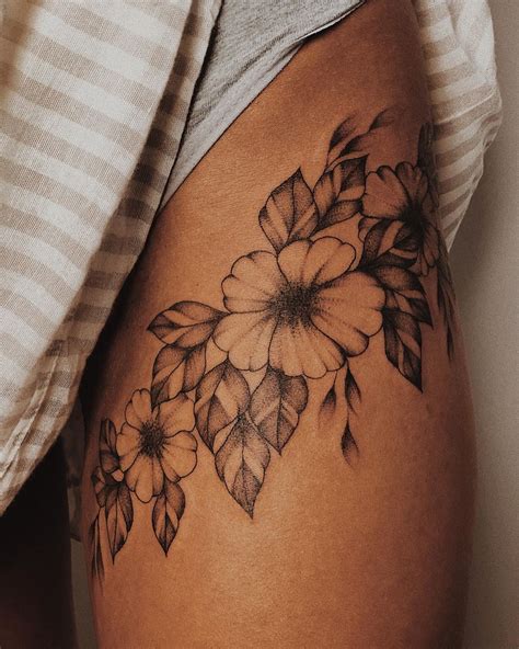 Revolutionary Flower Tattoo Designs For Thigh Ideas