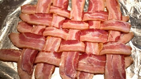 folding the top and bottom bacon strips towards the center creating a loop