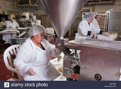 People working at food processing plant, making tamales, Miami, Florida