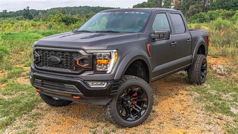The imposing Ford Black Widow truck, showcasing its aggressive stance and off-road capabilities.