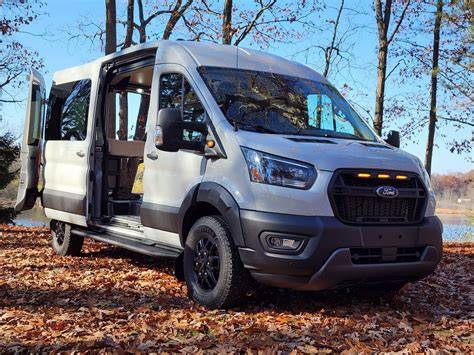 A sleek Ford camper van parked in a scenic natural landscape, highlighting its adventure capabilities