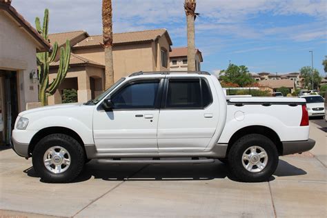 Front view of a classic Ford Explorer 2001 pickup in a scenic outdoor setting