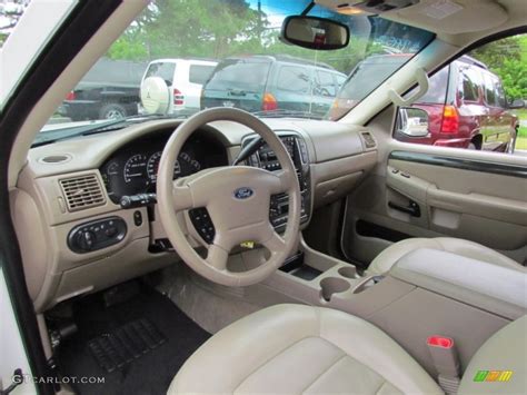 Interior of a well-maintained Ford Explorer 2002 showing dashboard and seating