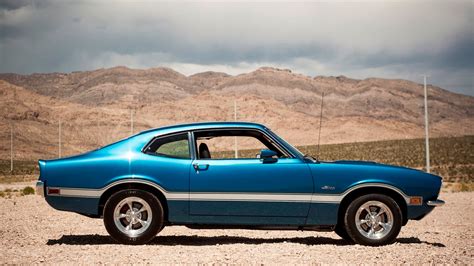 A detailed view of the engine bay of a Ford Maverick original