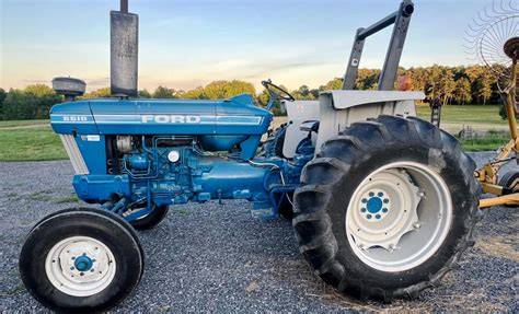 A robust Ford tractor tractor in a rural setting, showcasing its powerful design and versatility.