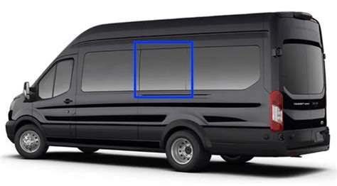 Close-up of a technician inspecting a Ford Transit middle window for damage