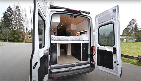 A professionally customized Ford Transit van build showcasing a functional interior