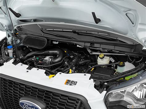 A modified Ford Transit van engine showcasing performance upgrades like an upgraded exhaust and air intake.
