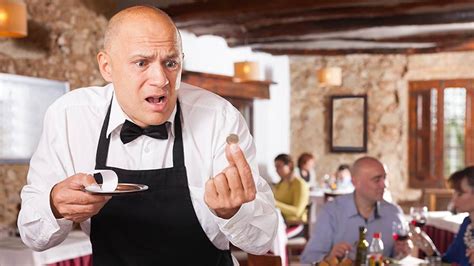 French waiter receiving a tip