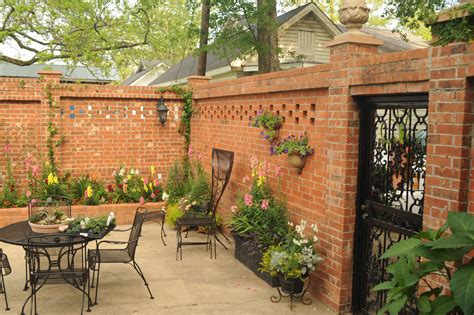 Here's a brick fence with wooden panels. New House Pinterest