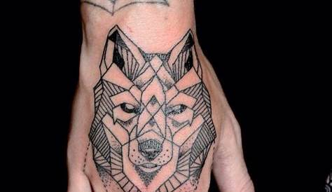 Geometric wolf head hand tattoo. www.tattooguy.co.uk