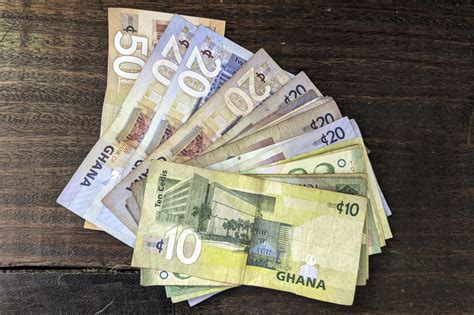 ghanaian currency to gbp