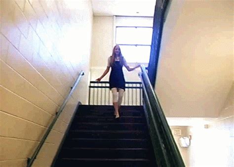 girl falling down stairs gif
