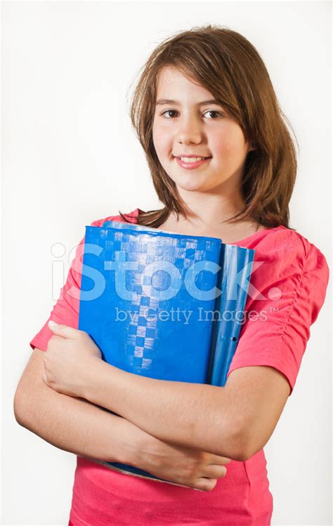 Girl holding book smiling