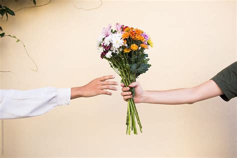 giving bouquet of flowers