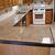 granite tile countertop with wood trim