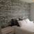 gray brick wallpaper bedroom