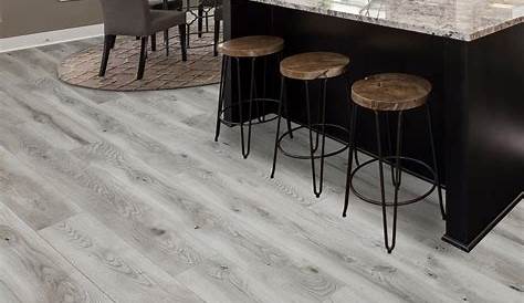 Grey 8mm laminate flooring w/pad attached 1. 59/Sf for Sale in