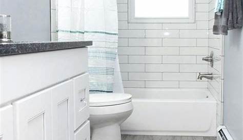 Bathroom Floor and shower tile is a Gray textured wood grain ceramic