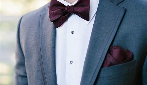  groom in a gray suit with a maroon bow tie classy