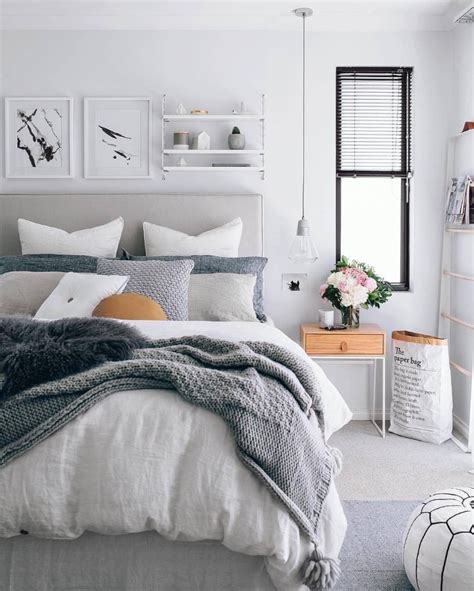grey+bed+in+a+Scandinavian-inspired+bedroom