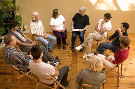 Group therapy session led by a mental health nurse
