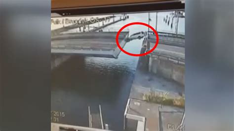 guy drives off bridge
