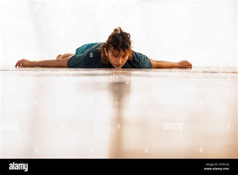 Man lying on soft floor, serene surroundings