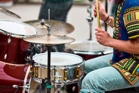 Guy Playing Drums In Car