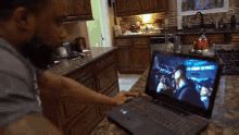 Guy Punches Through Computer Gif