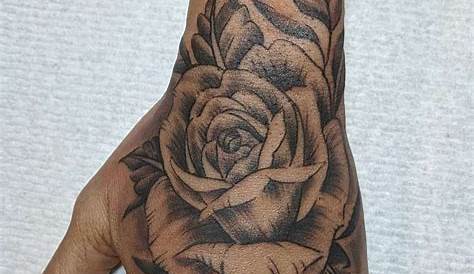 Classically placed rose hand tattoo by Lachie Grenfell