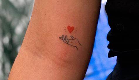 Hand Holding Heart Tattoo Pin On