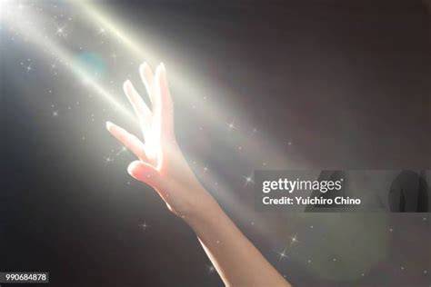 hand reaching for light