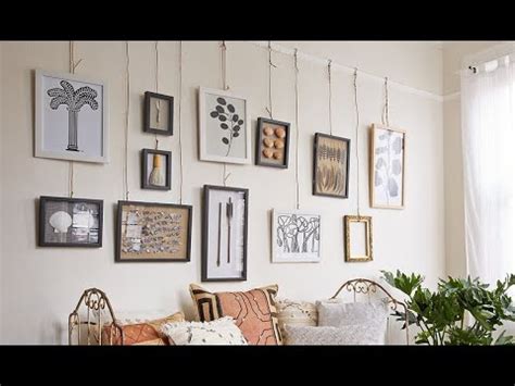 hanging paintings on plaster walls