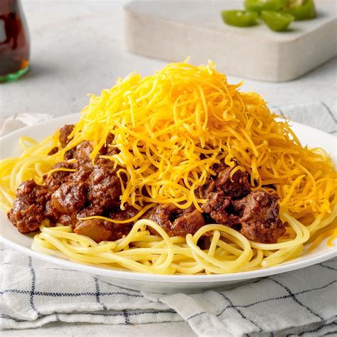 Cincinnati chili topped with chopped onions and grilled