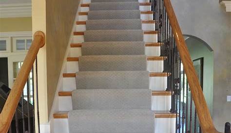 Stairs with combination of carpeting and hardwood. Hardwood on stair