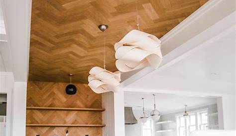 A white coffered ceiling and hardwood floors set a sophisticated tone